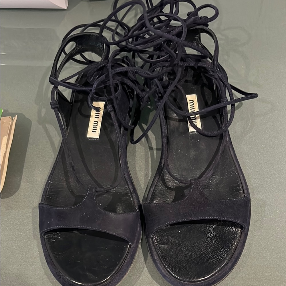 Miu Miu Black leather Sandals Elegant Design wraps up the leg
